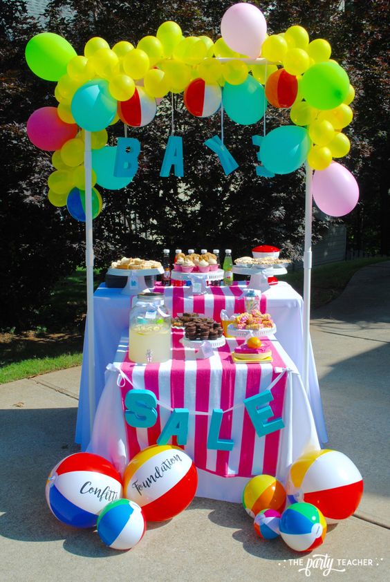 Make use of festive colors for your signs, tablecloths, and napkins.